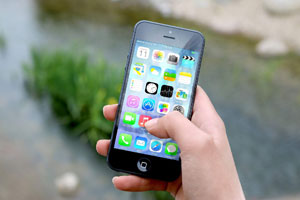 Man holding smartphone with medical ID app