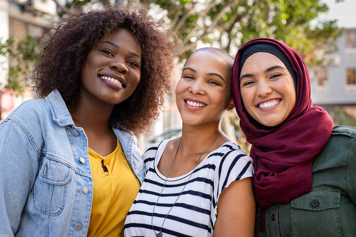 3 female friends smiling