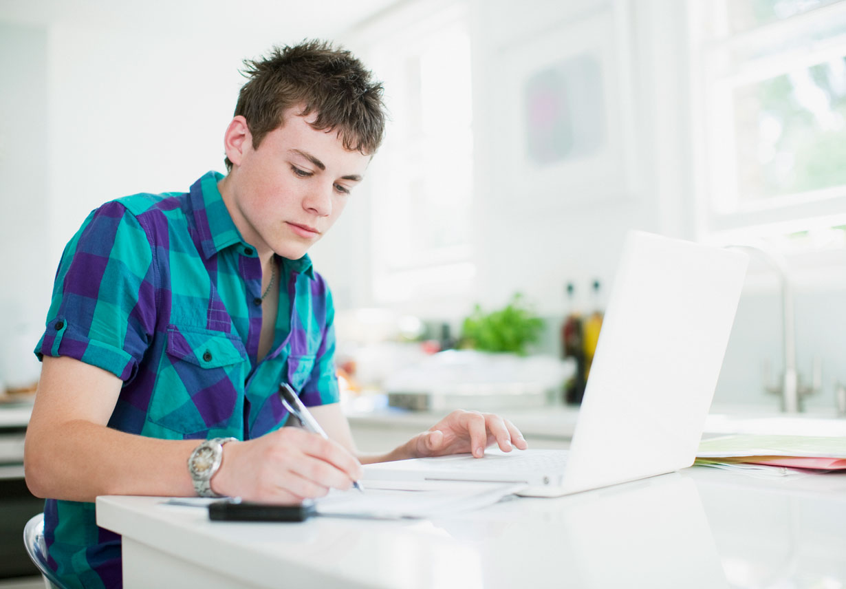 Young man making notes