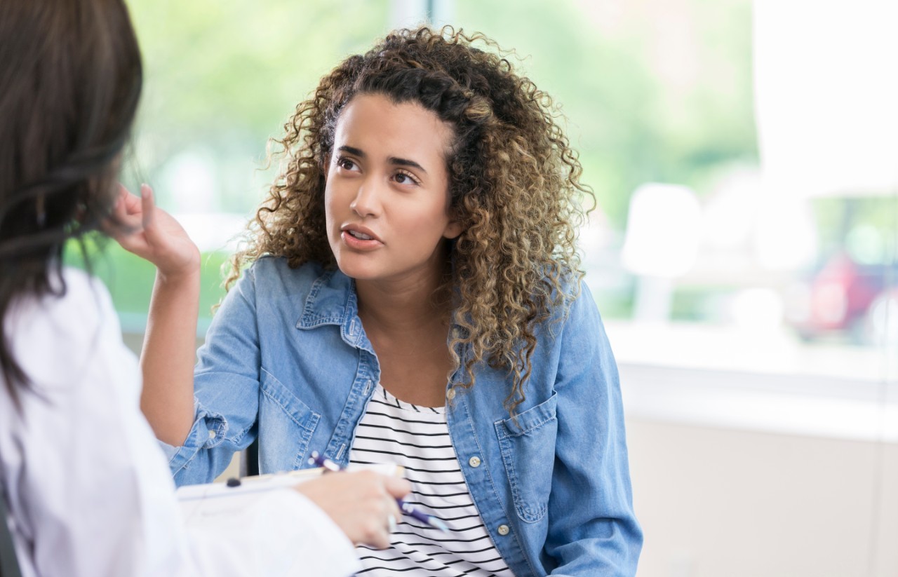 Young woman talking to a healthcare professional