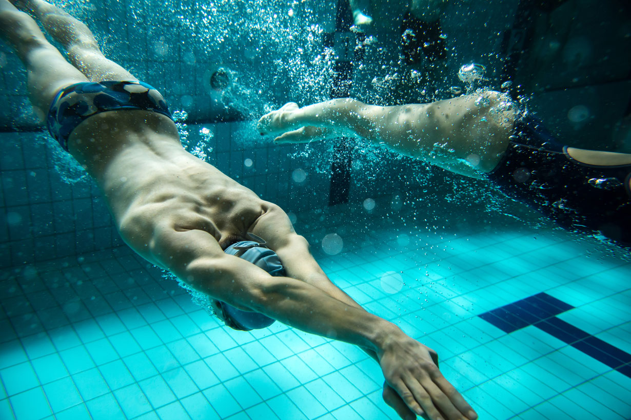 Two people swimming