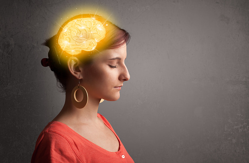 Young woman with a glowing brain illustration