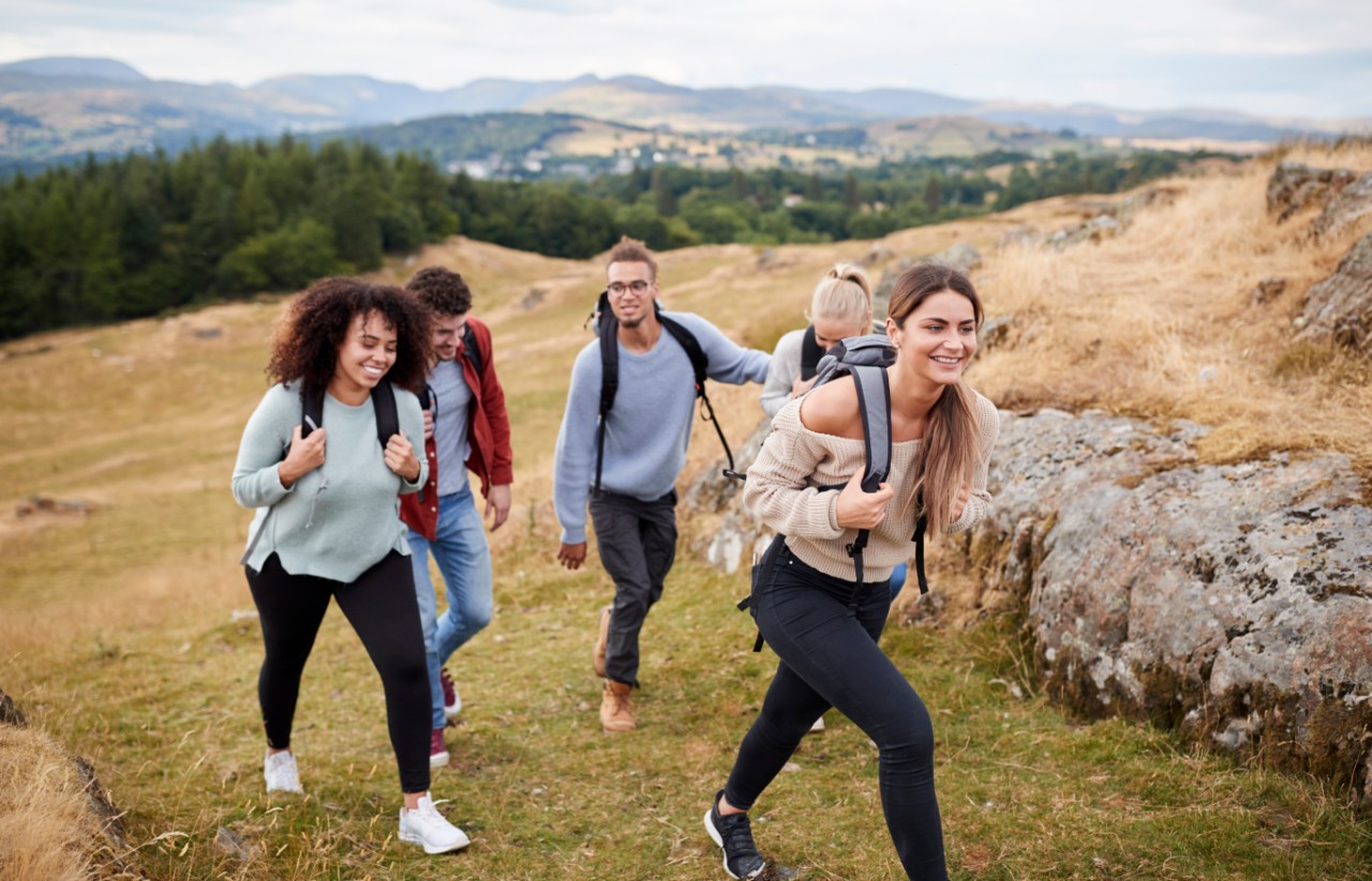 Group of friends walking up a hill