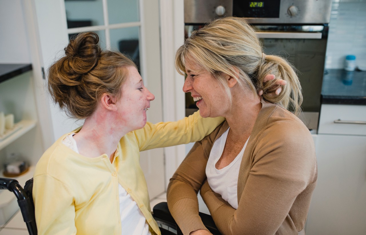 Disabled girl with her mum